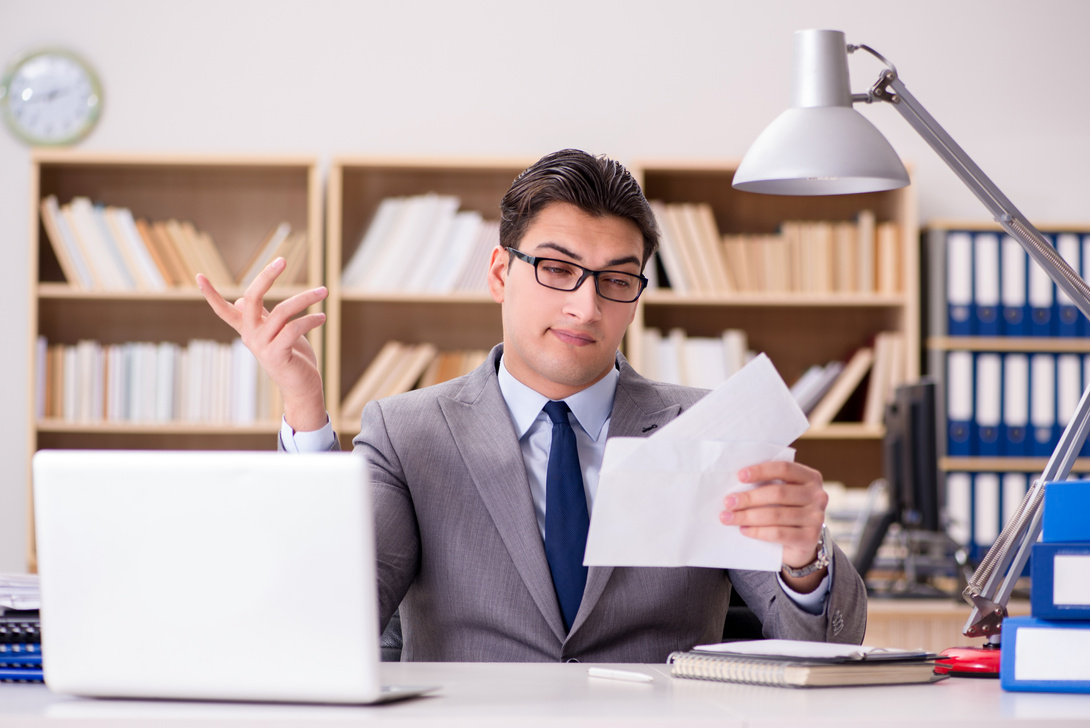 Businessman Receiving Letter in the Office